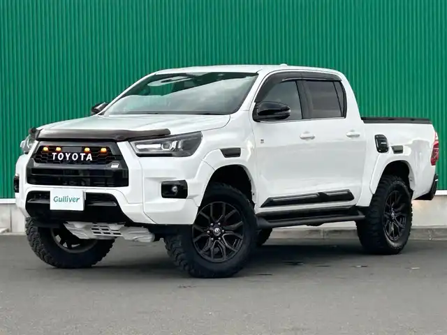 トヨタ ハイラックス Z GRスポーツ 宮城県 2022(令4)年 2.5万km スーパーホワイトⅡ リフトアップ/社外マフラー（JAOS BATTLEZ）/社外スピーカー/社外ツィータースピーカー/プリクラッシュセーフティ/レーンディパーチャーアラート/クリアランスソナー/バックソナー/ロードサインアシスト/先行車発進告知機能/レーダークルーズコントロール/パノラミックビューモニター/8インチディスプレイオーディオ（ナビ機能付）/・Bluetooth/・AppleCarPlay/AndroidAuto/・フルセグTV/ETC/ドライブレコーダー/ハーフレザーシート/革巻きステアリング/ステアリングスイッチ/パドルシフト/MTモード付AT/電動格納ミラー/リアデフロック/純正１８インチAW/フロアマット/ドアバイザー/W/サイド/カーテンエアバッグ