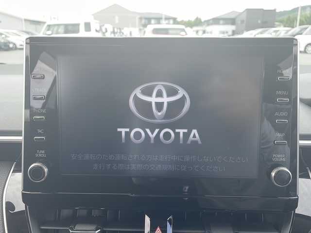 トヨタ カローラツーリング ハイブリッド S 岩手県 2019(令1)年 1.1万km ホワイトパールクリスタルシャイン 純正ナビ/AM/FM/Bluetooth/フルセグTV/バックカメラ/ETC/レーダークルーズコントロール/衝突被害軽減ブレーキ/レーンキープアシスト/横滑り防止装置/アイドリングストップ/シートヒーター/ステアリングヒーター/寒冷地仕様/オートライト/オートハイビーム/LEDヘッドライト/フォグランプ/スマートキー/プッシュスタート/電動格納ミラー/純正16インチAW/純正フロアマット/純正ドアバイザー/保証書/取扱説明書