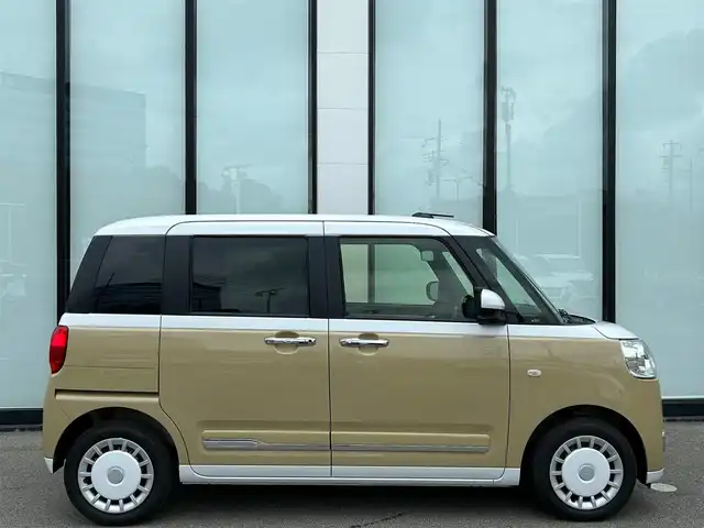 ダイハツ ムーヴ キャンバス ストライプス G 大阪府 2025(令7)年 0.3万km シャイニングホワイトパール/サンドベージュメタリック スマートアシスト/純正ナビ　/   フルセグTV/CD/DVD/Bluetooth/USB　/バックモニター　/クリアランスソナー　/前席シートヒーター　/両側パワースライドドア　/アイドリングストップ/オートマチックハイビーム/純正14インチアルミホイール　/純正フロアマット　/プッシュスタート　/スマートキー　/ＬＥＤライト