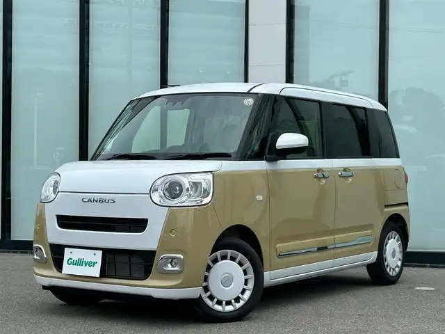 ダイハツ ムーヴ キャンバス ストライプス G 大阪府 2025(令7)年 0.3万km シャイニングホワイトパール/サンドベージュメタリック スマートアシスト/純正ナビ　/   フルセグTV/CD/DVD/Bluetooth/USB　/バックモニター　/クリアランスソナー　/前席シートヒーター　/両側パワースライドドア　/アイドリングストップ/オートマチックハイビーム/純正14インチアルミホイール　/純正フロアマット　/プッシュスタート　/スマートキー　/ＬＥＤライト