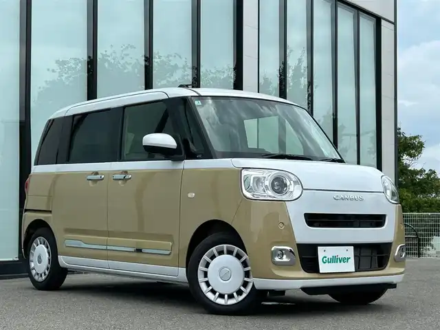 ダイハツ ムーヴ キャンバス ストライプス G 大阪府 2025(令7)年 0.3万km シャイニングホワイトパール/サンドベージュメタリック スマートアシスト/純正ナビ　/   フルセグTV/CD/DVD/Bluetooth/USB　/バックモニター　/クリアランスソナー　/前席シートヒーター　/両側パワースライドドア　/アイドリングストップ/オートマチックハイビーム/純正14インチアルミホイール　/純正フロアマット　/プッシュスタート　/スマートキー　/ＬＥＤライト