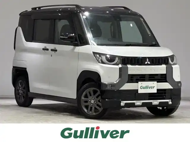 三菱 デリカミニ T プレミアム 宮城県 2024(令6)年 1万km アメジストブラック/シルキーホワイト 4WD/ターボ/リアスポイラーエアロ/e-アシスト/・衝突被害軽減ブレーキシステム/・車線逸脱警報システム/・標識認識システム/・ふらつき警報/マイパイロット/・同一車線運転支援機能/純正ナビ/・Bluetooth/AUX/iPad/前後コーナーセンサー/電子パーキング/オートブレーキホールド/ブラインドスポットモニター/デジタルインナーミラー/マルチアラウンドモニター/MTモード付きAT/シートヒーター（運転席/助手席）/プッシュボタン/LEDヘッドライト/オートライト/純正アルミホイール