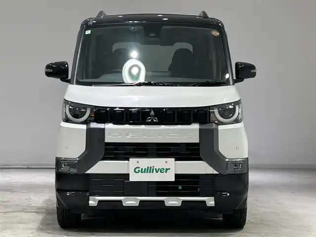 三菱 デリカミニ T プレミアム 宮城県 2024(令6)年 1万km アメジストブラック/シルキーホワイト 4WD/ターボ/リアスポイラーエアロ/e-アシスト/・衝突被害軽減ブレーキシステム/・車線逸脱警報システム/・標識認識システム/・ふらつき警報/マイパイロット/・同一車線運転支援機能/純正ナビ/・Bluetooth/AUX/iPad/前後コーナーセンサー/電子パーキング/オートブレーキホールド/ブラインドスポットモニター/デジタルインナーミラー/マルチアラウンドモニター/MTモード付きAT/シートヒーター（運転席/助手席）/プッシュボタン/LEDヘッドライト/オートライト/純正アルミホイール