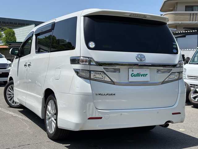 トヨタ ヴェルファイア 2．4Z 福岡県 2013(平25)年 5.4万km ホワイトパールクリスタルシャイン ワンオーナー/純正ナビ/（FM/CD/DVD/SD/Bluetooth/ワンセグTV）/オットマン（後部一列目）/横滑り防止/パーキングアシスト/ECOモード/プッシュスタート/ビルドインETC/純正アルミホイール/純正フロアマット/オートライト/フォグランプ/電格ミラー/スペアキー×１/保証書/取扱説明書