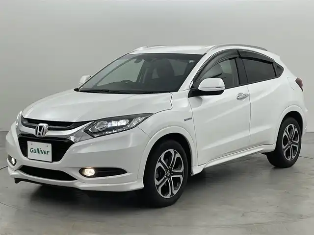 ホンダ ヴェゼル ハイブリッド Z 福岡県 2016(平28)年 8.3万km ホワイトオーキッドパール 純正７型ナビ（ＢＴ，フルセグＴＶ）　/バックカメラ　/ＥＴＣ　/前方ドライブレコーダー　/クルーズコントロール　/シティブレーキアクティブシステム　/ＥＣＯＮ　/パドルシフト　/ハーフレザーシート　/純正１７インチＡＷ