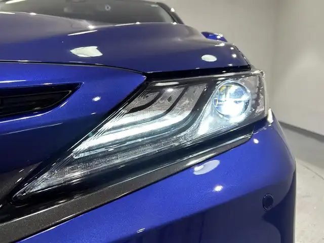 トヨタ カムリ WSレザーパッケージ 愛知県 2021(令3)年 2.8万km ダークブルーマイカM 純正９インチディスプレイオーディオ/衝突軽減ブレーキ/レーダークルーズコントロール　/レーンキープアシスト/クリアランスソナー/ブラインドスポットモニター/ビルトインＥＴＣ２．０/レザーシート/シートヒーター/バックカメラ/パドルシフト/ドライブレコーダー/カラーヘッドアップディスプレイ　/純正18インチアルミホイール/純正フロアマット/4WD