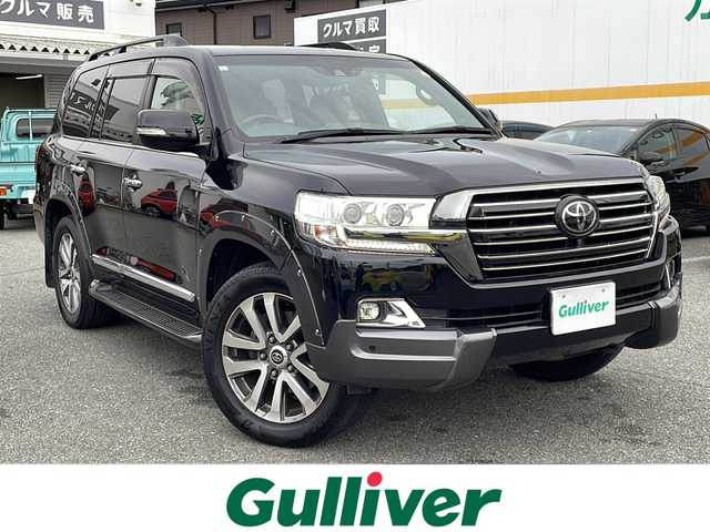 トヨタ ランドクルーザー ZX 山口県 2019(令1)年 5.7万km アティチュードブラックマイカ ワンオーナー/サンルーフ/茶レザーシート/前席/セカンドパワーシート/前席/セカンドシートヒーター/前席エアシート/サードシート電動格納/純正ナビ/DVD/CD/SD/MSV/USB/AUX/BT/純正フルセグTV/全周囲カメラ/純正LEDヘッドライト/純正フォグランプ/オートライト/オートハイビーム/純正２０インチアルミホイール/社外エアロ/ルーフレール/ウッドコンビステアリング/ステアリングヒーター/ステアリングスイッチ/クルーズコントロール/ウッド調パネル/衝突被害軽減ブレーキ/LDA/BSM/横滑り防止/コーナーセンサー/スマートキー×２/ビルトインETC2.0/純正フロアマット/トランクフロアマット/純正ドアバイザー/ドライブレコーダー/電動格納ウインカードアミラー(オート機能付き)