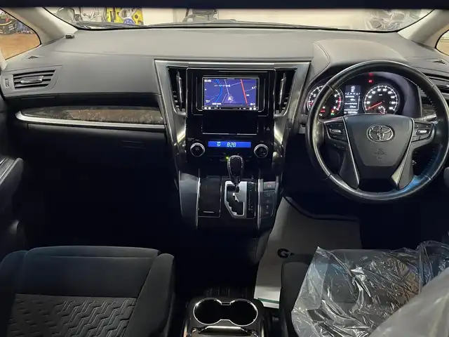 トヨタ ヴェルファイア Z Aエディション 道央・札幌 2016(平28)年 12.9万km ブラック 4WD/寒冷地仕様/社外ナビ/・フルセグTV/CD/DVD/BT/SD/社外フリップダウンモニター/バックカメラ/両側パワースライドドア/純正エンジンスターター/横滑り防止装置/アイドリングストップ/クルーズコントロール/ETC/電動パーキングブレーキ/ブレーキホールド/前後コーナーセンサー/オートライト/LEDヘッドライト/前後フォグライト/プッシュスタート/スマートキー/ウインカーミラー/純正フロアマット/純正ドアバイザー/純正18インチAW/助手席、2列目オットマン/3列シート