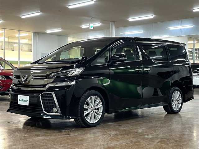 トヨタ ヴェルファイア Z Aエディション 道央・札幌 2016(平28)年 12.9万km ブラック 4WD/寒冷地仕様/社外ナビ/・フルセグTV/CD/DVD/BT/SD/社外フリップダウンモニター/バックカメラ/両側パワースライドドア/純正エンジンスターター/横滑り防止装置/アイドリングストップ/クルーズコントロール/ETC/電動パーキングブレーキ/ブレーキホールド/前後コーナーセンサー/オートライト/LEDヘッドライト/前後フォグライト/プッシュスタート/スマートキー/ウインカーミラー/純正フロアマット/純正ドアバイザー/純正18インチAW/助手席、2列目オットマン/3列シート