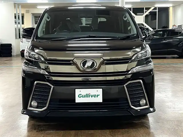 トヨタ ヴェルファイア Z Aエディション 道央・札幌 2016(平28)年 12.9万km ブラック 4WD/寒冷地仕様/社外ナビ/・フルセグTV/CD/DVD/BT/SD/社外フリップダウンモニター/バックカメラ/両側パワースライドドア/純正エンジンスターター/横滑り防止装置/アイドリングストップ/クルーズコントロール/ETC/電動パーキングブレーキ/ブレーキホールド/前後コーナーセンサー/オートライト/LEDヘッドライト/前後フォグライト/プッシュスタート/スマートキー/ウインカーミラー/純正フロアマット/純正ドアバイザー/純正18インチAW/助手席、2列目オットマン/3列シート