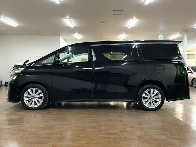 トヨタ ヴェルファイア Z Aエディション 道央・札幌 2016(平28)年 12.9万km ブラック 4WD/寒冷地仕様/社外ナビ/・フルセグTV/CD/DVD/BT/SD/社外フリップダウンモニター/バックカメラ/両側パワースライドドア/純正エンジンスターター/横滑り防止装置/アイドリングストップ/クルーズコントロール/ETC/電動パーキングブレーキ/ブレーキホールド/前後コーナーセンサー/オートライト/LEDヘッドライト/前後フォグライト/プッシュスタート/スマートキー/ウインカーミラー/純正フロアマット/純正ドアバイザー/純正18インチAW/助手席、2列目オットマン/3列シート