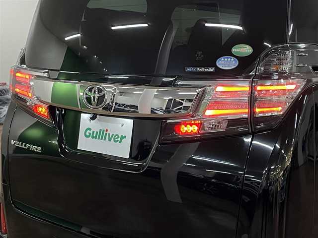 トヨタ ヴェルファイア Z Aエディション 道央・札幌 2016(平28)年 12.9万km ブラック 4WD/寒冷地仕様/社外ナビ/・フルセグTV/CD/DVD/BT/SD/社外フリップダウンモニター/バックカメラ/両側パワースライドドア/純正エンジンスターター/横滑り防止装置/アイドリングストップ/クルーズコントロール/ETC/電動パーキングブレーキ/ブレーキホールド/前後コーナーセンサー/オートライト/LEDヘッドライト/前後フォグライト/プッシュスタート/スマートキー/ウインカーミラー/純正フロアマット/純正ドアバイザー/純正18インチAW/助手席、2列目オットマン/3列シート