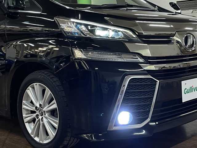 トヨタ ヴェルファイア Z Aエディション 道央・札幌 2016(平28)年 12.9万km ブラック 4WD/寒冷地仕様/社外ナビ/・フルセグTV/CD/DVD/BT/SD/社外フリップダウンモニター/バックカメラ/両側パワースライドドア/純正エンジンスターター/横滑り防止装置/アイドリングストップ/クルーズコントロール/ETC/電動パーキングブレーキ/ブレーキホールド/前後コーナーセンサー/オートライト/LEDヘッドライト/前後フォグライト/プッシュスタート/スマートキー/ウインカーミラー/純正フロアマット/純正ドアバイザー/純正18インチAW/助手席、2列目オットマン/3列シート