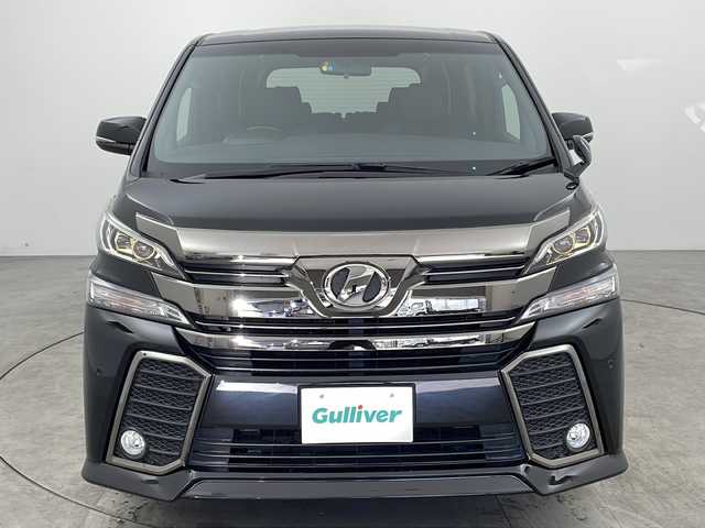 トヨタ ヴェルファイア Z Aエディション ゴールデンアイズ 福岡県 2017(平29)年 5.4万km ブラック ディーラーOP/メモリナビ/CD DVD BT フルセグTV/フリップダウンモニター/両側パワースライドドア/ハーフレザーシート/クリアランスソナー/クルーズコントロール/パワーバックドア/オットマン/スマートキー/ETC/LEDヘッドライト