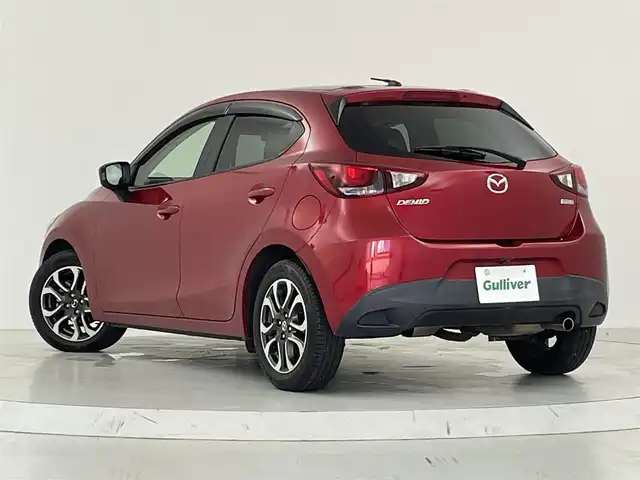 マツダ デミオ XD ツーリング Lパッケージ 大阪府 2015(平27)年 6.9万km ソウルレッドプレミアムメタリック 衝突軽減ブレーキ/　・車線逸脱警報/　・誤発進抑制機能/　。ブラインドスポットミニター/　・レーンキープアシスト/マツダコネクトナビ/　CD/DVD/Bluetooth/フルセグ/USB/バックカメラ/LEDオートライト/オートハイビーム/クルーズコントロール/ヘッドアップディスプレイ/パドルシフト/ハーフレザーシート/スマートキー/純正16インチアルミホイール/ビルトインETC/純正フロアマット