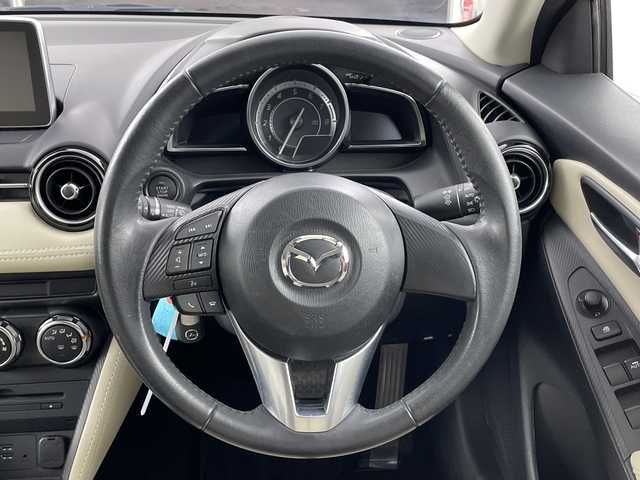 マツダ デミオ 13S Lパッケージ 愛知県 2014(平26)年 4.7万km スモーキーローズマイカ 禁煙車/純正7インチナビ/（CD/DVD/Bluetooth/ワンセグTV/SD)/バックカメラ/衝突軽減ブレーキ/ヘッドアップディスプレイ/ETC/ドライブレコーダー/ハーフレザーシート/アイドリングストップ/純正15インチアルミホイール/スマートキー/スペアキー1本/プッシュスタート/オートライト/LEDヘッドライト/純正フロアマット/オートエアコン/横滑り防止装置