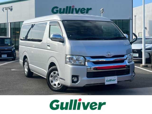 トヨタ ハイエース GL 愛媛県 2016(平28)年 5.6万km シルバーM 登録時走行距離：55299km/10人乗り/社外ナビ/AM/FM/ワンセグTV/DVD/CD/Bluetooth/ETC/バックカメラ/サイドアンダーミラー/サーキュレーター/後席背面ジュースホルダー/キセノンヘッドライト/フォグランプ/リモコンキー/純正フロアマット