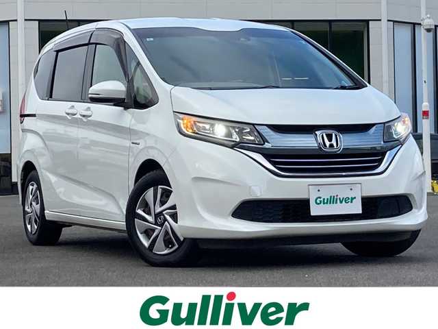 ホンダ フリード ハイブリット G ホンダセンシング 佐賀県 2017(平29)年 6.7万km ホワイトオーキッドパール Gathersナビ/バックカメラ/両側パワースライドドア/衝突被害軽減ブレーキ/路線逸脱警報/アダプティブクルーズコントロール/ビルトインETC/プッシュスタート/スマートキー/LEDヘッドライト