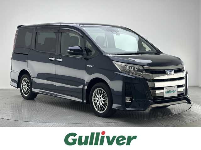 トヨタ ノア ハイブリッド Si ダブルバイビーⅡ 兵庫県 2019(平31)年 6.8万km ブラッキッシュアゲハガラスフレーク 衝突軽減ブレーキ/純正10インチナビ＆フルセグTV/（CD＆DVD＆BT）/フリップダウンモニター/バックカメラ/クルーズコントロール/前後ドライブレコーダー/ETC2.0/ハーフレザーシート/シートヒーター/両側電動スライドドア/オートライト/LEDライト/前後コーナーセンサー/Wエアバッグ