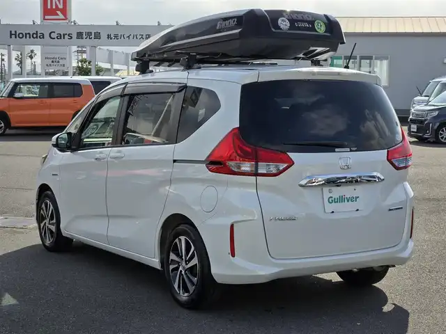ホンダ フリード ハイブリット EX 鹿児島県 2019(令1)年 3.8万km ホワイトオーキッドパール アダプティブクルーズコントロール　/両側パワースライドドア　/ビルトインＥＴＣ　/イノー製ルーフキャリア／ルーフレール　/前後ドライブレコーダー　/ホンダセンシング　/本革巻きステアリング　/Ｄ＋Ｎ席シートヒーター/純正SDナビ(VXM-194VFi)/プッシュスタート/スマートキー/Bluetoothオーディオ/レーンキープアシスト/横滑り防止装置/LEDヘッドライト/カーテンエアバック/エアバッグ(W+サイド)
