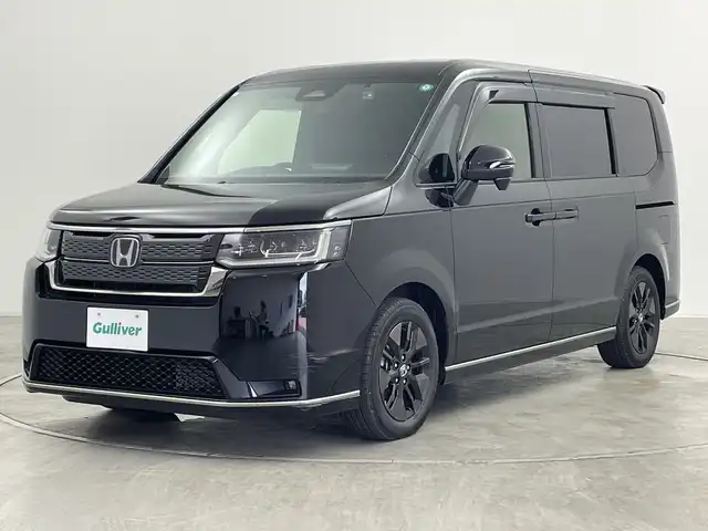 ホンダ ステップワゴン スパーダ eHEV 群馬県 2024(令6)年 1.7万km クリスタルブラックパール 純正１１．４型純正ナビ　バックカメラ　両側電動スライドドア　電動リアゲート　ハーフレザーシート　シートヒーター　ＥＴＣ　アダプティブクルーズコントロール　衝突被害軽減ブレーキ　ＢＳＭ　ＬＥＤ　禁煙車