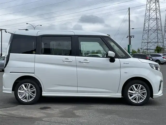 スズキ ソリオ HV MZ 道央・札幌 2024(令6)年 1.4万km ピュアホワイトP ４WD/社外メモリーナビ/AM/FM/BT/スズキセーフティサポート/衝突被害軽減ブレーキ/横滑り防止装置/レーダークルーズコントロール/レーンキープアシスト/リヤパーキングセンサー/バックカメラ/ETC/アイドリングストップ/片側パワースライドドア/前席シートヒーター/ステアリングリモコン/プッシュスタート/スマートキー/ハロゲンヘッドライト/オートライト/オートハイビーム/ヘッドライトレベライザー/電動格納ミラー/ヒーテッドドアミラー/フロアマット/レンタカー登録