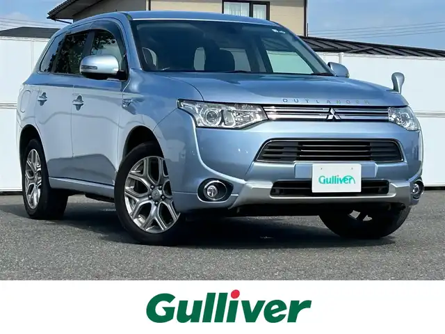 三菱 アウトランダー ＰＨＥＶ G セーフティパッケージ 岩手県 2014(平26)年 17.1万km テクニカルシルバーメタリック 4WD/eアシスト/　　・衝突被害軽減ブレーキシステム/　　・車線逸脱警報システム/　　・レーダークルーズコントロールシステム/　　・誤発進抑制機能/純正メモリナビ/　　CD/DVD/フルセグTV/バックカメラ/HIDヘッドライト/フォグランプ/シートヒーター/純正18インチアルミホイール/ステアリングスイッチ/パドルシフト/スマートキー/ETC