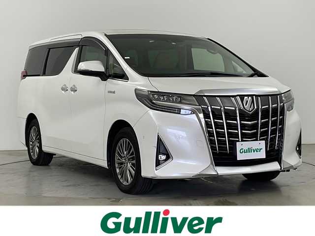 トヨタ アルファードハイブリット エグゼクティブ ラウンジ 道央・札幌 2020(令2)年 3.4万km ホワイトパールクリスタルシャイン ・４WD/・トヨタセーフティセンス/・プリクラッシュセーフティ/・レーダークルーズコントロール/・JBLプレミアムサウンド/・アドバンストパークスイッチ/・純正メーカーナビ/・Bluetooth/CD/DVD/USB/フルセグTV/・AndroidAuto/AppleCarPlay/・アラウンドビューモニター/・両側パワースライドドア/・パワーバックドア/・全席パワーシート/全席シートヒーター/・全席エアシート/ステアリングヒーター/・3眼LEDヘッドライト/・オートライト/オートマチックハイビーム/・スマートキー/・デジタルインナーミラー/・シートメモリー/・リアシートエンターテインメントシステム/・レーンキープアシスト/・横滑り防止装置/盗難防止装置/・AC100V/ETC2.0/・社外ドライブレコーダー前後（CSD-790FHG）/・積込スタッドレス社外AW付
