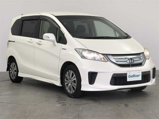 ホンダ フリード ハイブリット ジャストセレクション 愛知県 2012(平24)年 6.4万km プレミアムホワイトパール 社外7インチナビ/横滑り防止装置/クルーズコントロール/革巻きステアリング/HIDライト/オートライト/両側パワースライドドア/ETC/純正AW/純正フロアマット/プッシュスタート/スマートキー/スペアキー