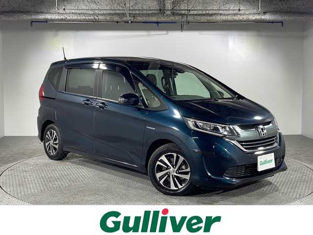 ホンダ フリード＋ ハイブリット EX 沖縄県 2019(平31)年 5.8万km フォレストグリーンパール 県外仕入 /禁煙車 /純正9インチナビ　/（フルセグTV　Bluetooth接続　CD DVD再生）/両側パワーバックドア　/バックカメラ　/コーナーセンサー　/ドライブレコーダー　/ETC　/シートヒーター　/純正アルミホイール/純正フロアマット/革巻きステアリング/ドアバイザー