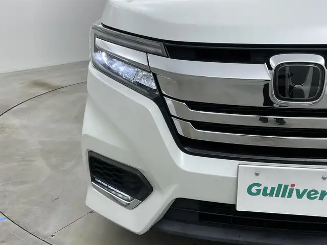 ホンダ ステップワゴン スパーダ eHEV G ホンダS 岡山県 2021(令3)年 2.9万km プラチナホワイトパール 社外８インチメモリナビゲーション【MDV-S706L】/　（CD/DVD/フルセグTV/BT/USB）/社外12.1インチフリップダウンモニター/バックカメラ/両側パワースライドドア/追従型クルーズコントロール/LEDヘッドライト（AUTO機能付き）/ビルトインETC/衝突軽減ブレーキシステム/車線逸脱防止システム/横滑り防止装置/社外ドライブレコーダー（前後）/純正16インチアルミホイール/純正フロアマット/プッシュスタート/スマートキー/新車保証書/取扱説明書/スペアキー×１
