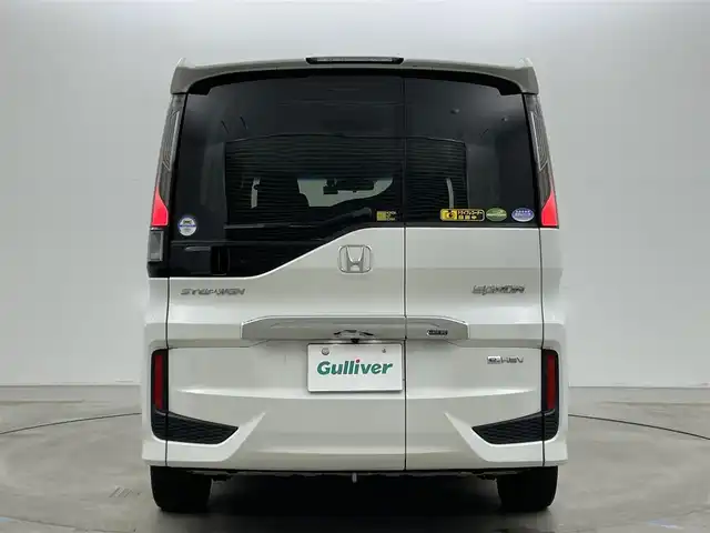 ホンダ ステップワゴン スパーダ eHEV G ホンダS 岡山県 2021(令3)年 2.9万km プラチナホワイトパール 社外８インチメモリナビゲーション【MDV-S706L】/　（CD/DVD/フルセグTV/BT/USB）/社外12.1インチフリップダウンモニター/バックカメラ/両側パワースライドドア/追従型クルーズコントロール/LEDヘッドライト（AUTO機能付き）/ビルトインETC/衝突軽減ブレーキシステム/車線逸脱防止システム/横滑り防止装置/社外ドライブレコーダー（前後）/純正16インチアルミホイール/純正フロアマット/プッシュスタート/スマートキー/新車保証書/取扱説明書/スペアキー×１