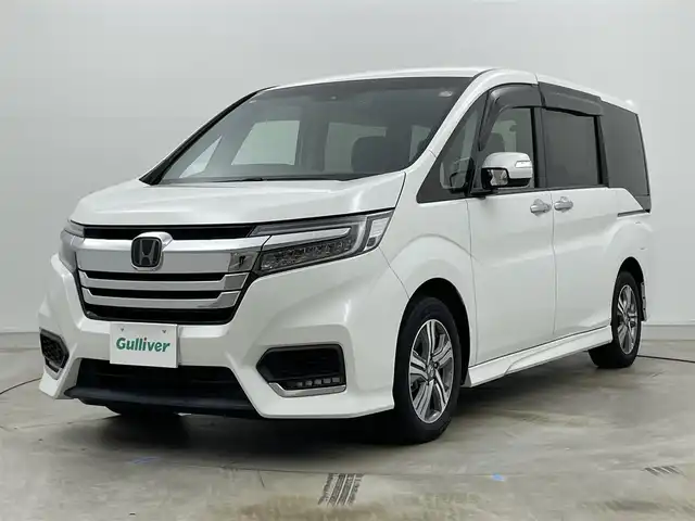 ホンダ ステップワゴン スパーダ eHEV G ホンダS 岡山県 2021(令3)年 2.9万km プラチナホワイトパール 社外８インチメモリナビゲーション【MDV-S706L】/　（CD/DVD/フルセグTV/BT/USB）/社外12.1インチフリップダウンモニター/バックカメラ/両側パワースライドドア/追従型クルーズコントロール/LEDヘッドライト（AUTO機能付き）/ビルトインETC/衝突軽減ブレーキシステム/車線逸脱防止システム/横滑り防止装置/社外ドライブレコーダー（前後）/純正16インチアルミホイール/純正フロアマット/プッシュスタート/スマートキー/新車保証書/取扱説明書/スペアキー×１