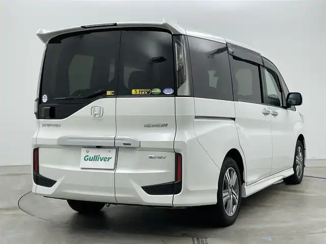 ホンダ ステップワゴン スパーダ eHEV G ホンダS 岡山県 2021(令3)年 2.9万km プラチナホワイトパール 社外８インチメモリナビゲーション【MDV-S706L】/　（CD/DVD/フルセグTV/BT/USB）/社外12.1インチフリップダウンモニター/バックカメラ/両側パワースライドドア/追従型クルーズコントロール/LEDヘッドライト（AUTO機能付き）/ビルトインETC/衝突軽減ブレーキシステム/車線逸脱防止システム/横滑り防止装置/社外ドライブレコーダー（前後）/純正16インチアルミホイール/純正フロアマット/プッシュスタート/スマートキー/新車保証書/取扱説明書/スペアキー×１