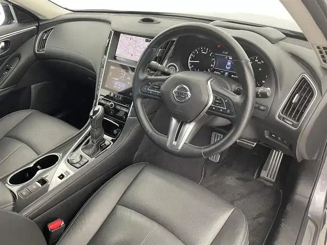 日産 スカイライン ハイブリッド GT タイプSP 富山県 2020(令2)年 3.8万km ダークメタルグレー 純正ナビ（AM/FM/DVD/BT/USB/フルセグ）/全方位カメラ/ETC/BSW（後側方車両検知警報）/衝突被害軽減システム/レーダークルーズコントロール/レーンキープアシスト/コーナーセンサー/横滑り防止装置/アイドリングストップ/レザーシート/D/N席パワーシート/D席メモリシート/シートヒーター/純正アルミホイール/純正フロアマット/オートLEDライト/オートホールド付電子パーキング/革巻きステアリング/ステアリングスイッチ/パドルシフト/スマートキー/スペアキー