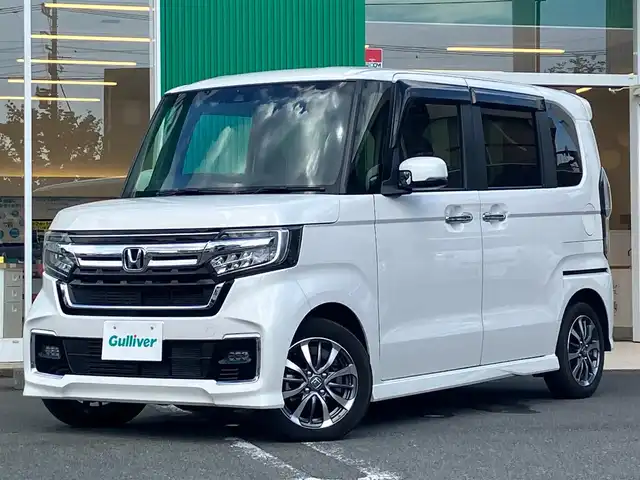 ホンダ Ｎ ＢＯＸ カスタム EX 静岡県 2022(令4)年 3.4万km プラチナホワイトパール エンジンスタートボタン/保証書/取扱説明書/パワーステアリング/パワーウィンドウ/アイドリングストップ/スマートキー（スペアキー1本）/AAC/クルーズコントロール/バックカメラ/純正SDナビ（フルセグTV、BT接続、DVD再生機能、CDチェンジャー）/USB入力端子/ビルトインETC/ウォークスルー/純正フロアマット/純正アルミホイール/布系シート/D+N席シートヒーター/両側パワースライドドア/ABS/横滑り防止装置/コーナーセンサー/レーンキープアシスト/オートライト/オートマチックハイビーム/LEDヘッドライト/W+サイドエアバッグ/衝突軽減システム/カーテンエアバック