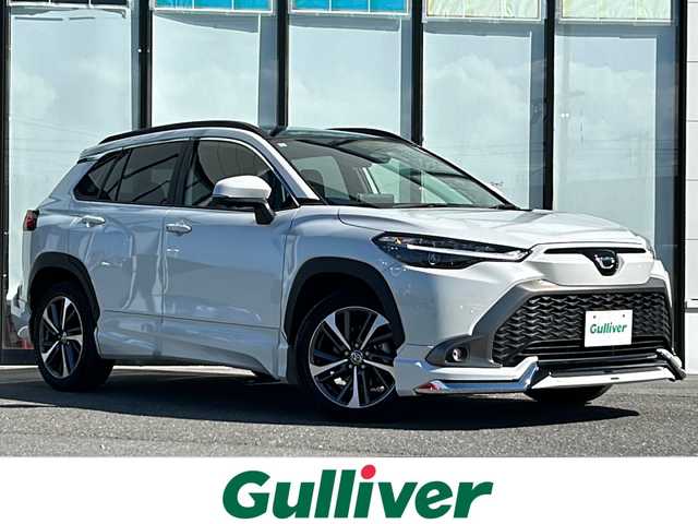 トヨタ カローラ クロス ハイブリッド Z 山形県 2025(令7)年 0.7万km プラチナホワイトパールマイカ 純正ナビ/（AM/FM/フルセグ/BT）/ガラスルーフ/ステアリングスイッチ/レーダークルーズコントロール/パーキングアシスト/全周囲カメラ/モデリスタエアロ（Fスポイラー）/前後コーナーセンサー/前席シートヒーター/運転席パワーシート/電動パーキング/オートブレーキホールド/電動リアゲート/ビルトインETC2.0/BSM/電動格納ミラー/ルーフレール