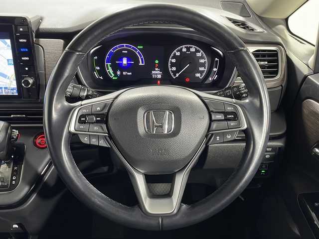 ホンダ オデッセイ ハイブリッド e:HEVアブソルート EX 広島県 2021(令3)年 4.4万km プレミアムスパークルブラックパール 禁煙車/純正１０型ナビ/全周囲カメラ/シートヒーター/１５００Ｗ給電/電動リアゲート/パワーシート/ブラインドスポットモニター/パーキングアシスト/両側パワースライドドア/レーダークルーズコントロール/ＥＴＣ２．０/エアバッグ(運転席/助手席/サイド/カーテン)/純正18インチアルミホイール(225/50/R18)