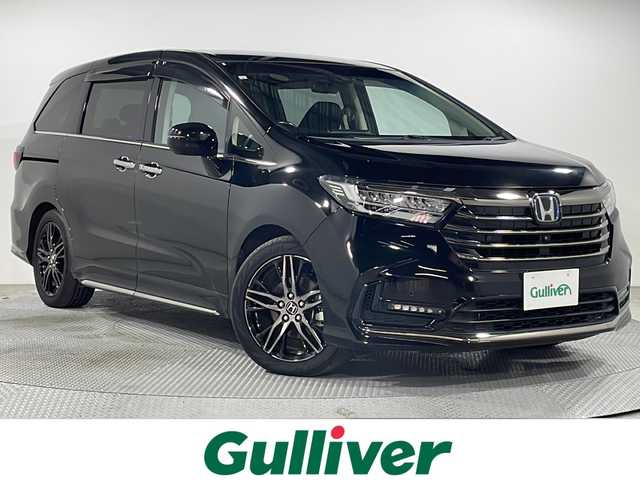 ホンダ オデッセイ ハイブリッド e:HEVアブソルート EX 広島県 2021(令3)年 4.4万km プレミアムスパークルブラックパール 禁煙車/純正１０型ナビ/全周囲カメラ/シートヒーター/１５００Ｗ給電/電動リアゲート/パワーシート/ブラインドスポットモニター/パーキングアシスト/両側パワースライドドア/レーダークルーズコントロール/ＥＴＣ２．０/エアバッグ(運転席/助手席/サイド/カーテン)/純正18インチアルミホイール(225/50/R18)