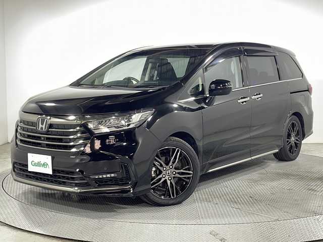 ホンダ オデッセイ ハイブリッド e:HEVアブソルート EX 広島県 2021(令3)年 4.4万km プレミアムスパークルブラックパール 禁煙車/純正１０型ナビ/全周囲カメラ/シートヒーター/１５００Ｗ給電/電動リアゲート/パワーシート/ブラインドスポットモニター/パーキングアシスト/両側パワースライドドア/レーダークルーズコントロール/ＥＴＣ２．０/エアバッグ(運転席/助手席/サイド/カーテン)/純正18インチアルミホイール(225/50/R18)