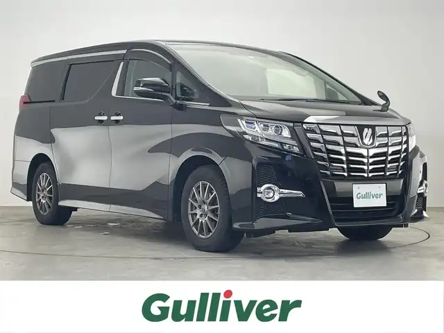 トヨタ アルファード S Cパッケージ 滋賀県 2016(平28)年 7.3万km ブラック 社外ナビ/（CD/DVD/SD/Bluetooth/フルセグTV）/バックカメラ/社外フリップダウンモニター/前方ドライブレコーダー/ビルトインETC/両側電動スライドドア/パワーバックドア/クリアランスソナー/ハーフレザーシート/パワーシート/D席シートメモリー/ウッドコンビステアリング/クルーズコントロール/ステアリングリモコン/ステアリングヒーター/LEDヘッドライト/フォグランプ/オートヘッドライト/電動パーキングブレーキ/オートホールドブレーキ/積み込みスタッドレスタイヤ/スペアキー/リアロールサンシェイド/nanoe/AC100V/オートリトラーミラー