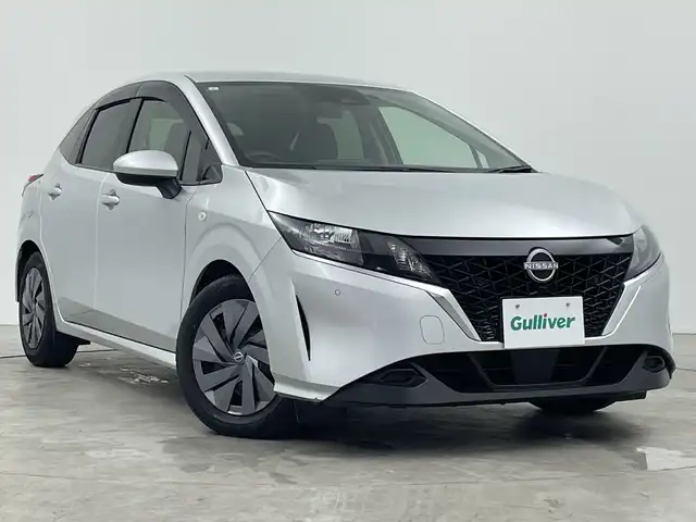 日産 ノート S 三重県 2021(令3)年 2.1万km ブリリアントシルバー 禁煙車　/純正９インチメモリーナビ/・フルセグTV/・CD/BT/SD/エマージェンシーブレーキ　/車線逸脱防止装置　/前後コーナーセンサー　/バックカメラ　/社外前方ドライブレコーダー　/サイド／カーテンエアバッグ　/純正ビルトインＥＴＣ/オートAC/電子サイドブレーキ/ブレーキオートホールド