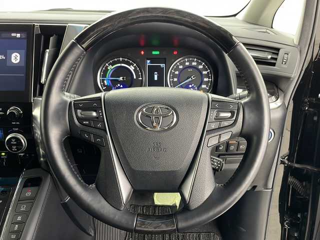 トヨタ アルファードハイブリット SR Cパッケージ 道央・札幌 2021(令3)年 1.6万km ブラック ・４WD/・モデリスタエアロ(F.R.S)/・JBLサウンド/・純正ナビ(TV&CD&DVD&BT&Miracost)/・純正フリップダウンモニター/・トヨタセーフティセンス/・クルーズコントロール/・パーキングアシスト/・両側パワースライドドア/・全方位カメラ/・社外ドラレコ(前後)/・パワーバックドア/・D/N2列目パワーシート/・エアシートDN席/・ハンドルヒーター/・D/Nシートヒーター/・AC100V/・デジタルインナーミラー/・LEDヘッドライト三眼/・LEDフォグライト/・オートマチックハイビーム/・ETC2.0ビルトイン/・プッシュスタート/・スマートキー
