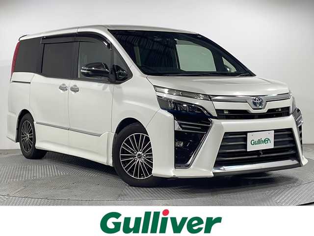 トヨタ ヴォクシー ZS 煌 広島県 2018(平30)年 4.5万km ホワイトパールクリスタルシャイン ALPINE11型ナビ/ALPINEフリップダウンモニター/両側パワースライドドア/サイド/バックカメラ/社外デジタルインナーミラー/セーフティンセンス/・プリクラッシュセーフティ/・レーンディパーチャーアラート/・オートマチックハイビーム/クルーズコントロール/LEDヘッドランプ/USB/HDMI入力端子/ETC