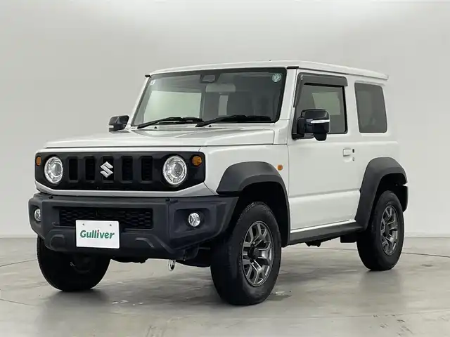 スズキ ジムニー シエラ JC 群馬県 2019(令1)年 2.4万km ピュアホワイトP Clarionオーディオ/　・AM/FM/CD/USB/デュアルセンサーブレーキサポート/誤発進抑制機能/車線逸脱警報/ふらつき警報機能/先行車発信お知らせ機能/クルーズコントロール/ダウンヒルアシストコントロール/LEDヘッドライト/オートライト/前席シートヒーター/ヘッドライトウォッシャー/純正フロアマット/純正15インチアルミホイール/スマートキー/スペアキー