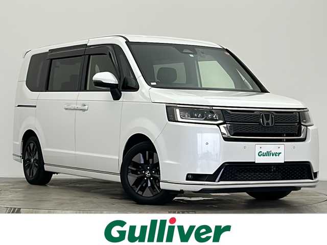 ホンダ ステップワゴン スパーダ 宮城県 2023(令5)年 6.7万km プラチナホワイトパール ホンダセンシング//純正ナビ（LXM-237VFLi）/・Bluetooth/CD/DVD/HDMI/フルセグTV//バックカメラ//両側パワースライドドア//アダプティブクルーズコントロール//衝突被害軽減ブレーキ//踏み間違い軽減//路外逸脱警報//先行車発進お知らせ//標識認識機能//ブラインドスポットモニター//パワーバックドア//LEDヘッドライト//オートライト//オートマチックハイビーム//前席シートヒーター//ハーフレザーシート//パドルシフト//電動パーキング//ウォークスルー//革巻きステアリング//ヘッドライトリベライザー//ECON//横滑り防止装置//アイドリングストップ