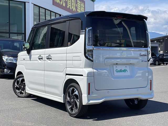 スズキ スペーシア カスタム HYBRID XS ターボ 長野県 2023(令5)年 0.1千km ピュアホワイトパール/ブラック2トーン ターボ/純正メモリナビ/（フルセグTV/AM/FM/BT）/全方位モニター/HDMI/純正前後ドラレコ/シートヒーター/ステアリングヒーター/スズキセーフティサポート/レーダークルーズコントロール/レーンキープアシスト/ブレーキホールド/2列目オットマン/両側パワースライドドア/エアバック（W＋サイド）/純正15インチアルミホイール/アイドリングストップ/横滑り防止機能/ヘッドアップディスプレイ/純正LEDヘッドライト/フォグランプ/パドルシフト/サンシェード/ウィンカーミラー/ルーフブラックツートンカラー