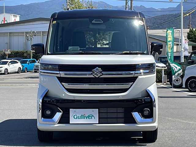 スズキ スペーシア カスタム HYBRID XS ターボ 長野県 2023(令5)年 0.1千km ピュアホワイトパール/ブラック2トーン ターボ/純正メモリナビ/（フルセグTV/AM/FM/BT）/全方位モニター/HDMI/純正前後ドラレコ/シートヒーター/ステアリングヒーター/スズキセーフティサポート/レーダークルーズコントロール/レーンキープアシスト/ブレーキホールド/2列目オットマン/両側パワースライドドア/エアバック（W＋サイド）/純正15インチアルミホイール/アイドリングストップ/横滑り防止機能/ヘッドアップディスプレイ/純正LEDヘッドライト/フォグランプ/パドルシフト/サンシェード/ウィンカーミラー/ルーフブラックツートンカラー