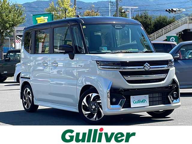 スズキ スペーシア カスタム HYBRID XS ターボ 長野県 2023(令5)年 0.1千km ピュアホワイトパール/ブラック2トーン ターボ/純正メモリナビ/（フルセグTV/AM/FM/BT）/全方位モニター/HDMI/純正前後ドラレコ/シートヒーター/ステアリングヒーター/スズキセーフティサポート/レーダークルーズコントロール/レーンキープアシスト/ブレーキホールド/2列目オットマン/両側パワースライドドア/エアバック（W＋サイド）/純正15インチアルミホイール/アイドリングストップ/横滑り防止機能/ヘッドアップディスプレイ/純正LEDヘッドライト/フォグランプ/パドルシフト/サンシェード/ウィンカーミラー/ルーフブラックツートンカラー