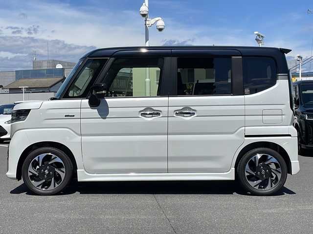 スズキ スペーシア カスタム HYBRID XS ターボ 長野県 2023(令5)年 0.1千km ピュアホワイトパール/ブラック2トーン ターボ/純正メモリナビ/（フルセグTV/AM/FM/BT）/全方位モニター/HDMI/純正前後ドラレコ/シートヒーター/ステアリングヒーター/スズキセーフティサポート/レーダークルーズコントロール/レーンキープアシスト/ブレーキホールド/2列目オットマン/両側パワースライドドア/エアバック（W＋サイド）/純正15インチアルミホイール/アイドリングストップ/横滑り防止機能/ヘッドアップディスプレイ/純正LEDヘッドライト/フォグランプ/パドルシフト/サンシェード/ウィンカーミラー/ルーフブラックツートンカラー